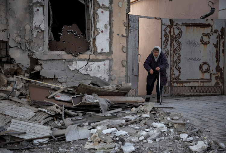 A Ukrainian resident near her house in Kherson, after it was destroyed by a Russian strike. Picture: OLEKSANDR RATUSHNIAK/REUTERS