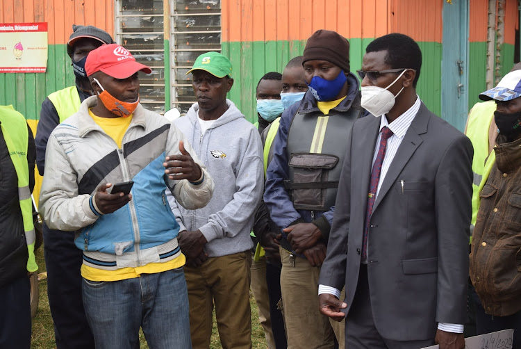 Ruiru MP Simon King'ara and boda boda operators in Ruiru town on Monday.