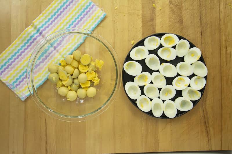 Boiled Eggs Cut In Half With Yolks In Bowl