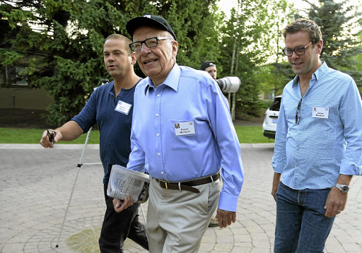 News Corporation executive chairman Rupert Murdoch is flanked by sons and heirs Lachlan and James.