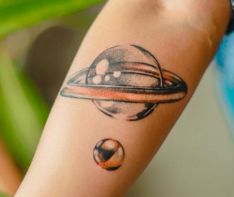 Water Drop Saturn With Earth Planet Tattoo Design Meaning