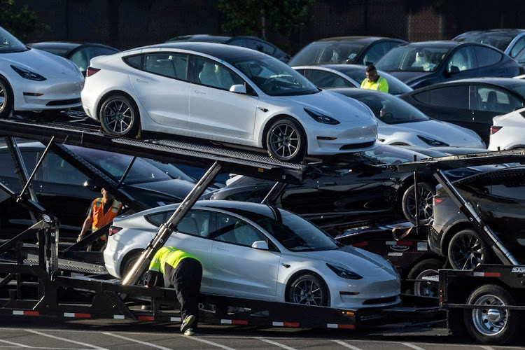 Tesla Model 3 vehicles at a Tesla facility in Fremont, California, the US, May 23 2023. Picture: Reuters/Carlos Barria