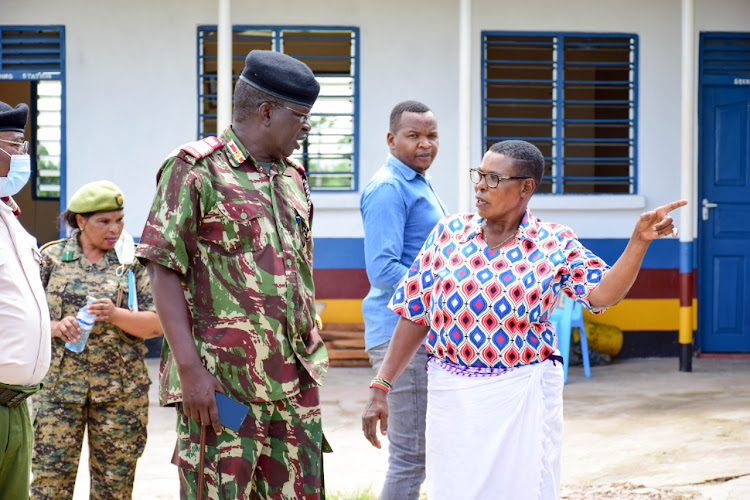 Coast regional commissioner John Elungata speaks to an IDP at the Kibaoni police station.