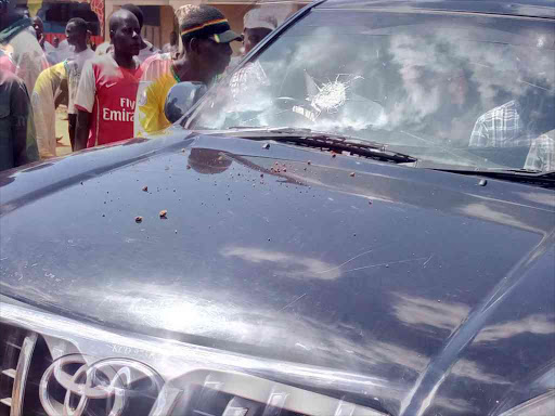 The broken windscreen of Raila's car after it was hit by stones from rowdy youth at Shibale in Mumias/FILE