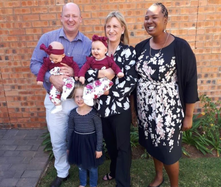 The Dickason family, Graham and Lauren, 6-year-old Liané, and the 2-year-old twins Maya and Karla, with nanny Mendy Sibanyoni at the twins' christening in 2019.