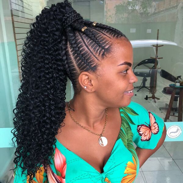 Braided Curly Ponytail - a woman wearing a gold necklace