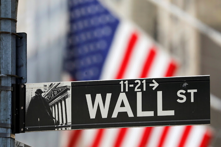 A Wall Street sign outside the New York Stock Exchange in New York, the US, July 19 2021. Picture: REUTERS/ANDREW KELLY