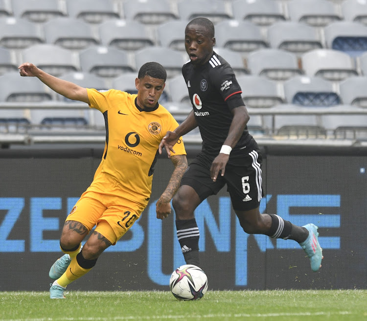 Keagan Dolly of Kaizer Chiefs is challenged by Ben Motshwari of Orlando Pirates during the DStv Premiership match between Orlando Pirates and Kaizer Chiefs at Orlando Stadium on Saturday.