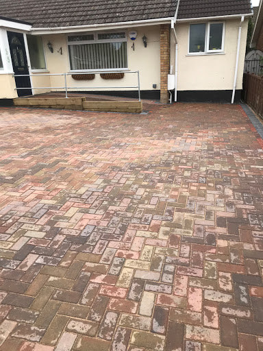Blockpaved driveway  with retaining sleepers 
