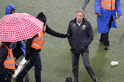 Kaizer Chiefs coach Stuart Baxter laves the field after the DStv Premiership match against SuperSport United at FNB Stadium on April 16 2022.