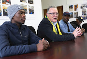 Cameron Dugmore, leader of the ANC caucus in the Western Cape legislature, with Stellenbosch University student Babalo Ndwayana, left, and his uncle Anele Mnyondo on May 18.