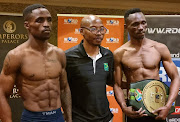 Lusanda Komanisi and Tshifhiwa Munyai after the weigh-in conducted by BSA-Gauteng manager Lehlo Ramagole.