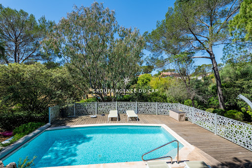 Outdoor swimming pool with wooden deck and loungers in this luxury villa for sale in Saint-raphael ($1,040,244 - 142 m²)
