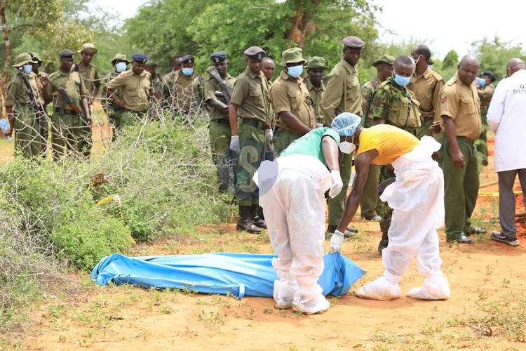 Detectives exhuming bodies in Shakahola forest on June 12, 2023.