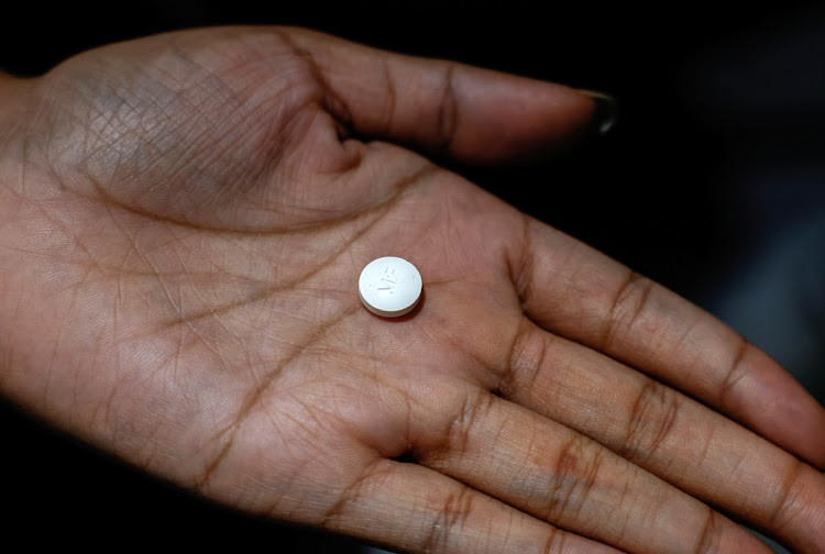 A patient prepares to take Mifepristone, the first medication in a medical abortion.