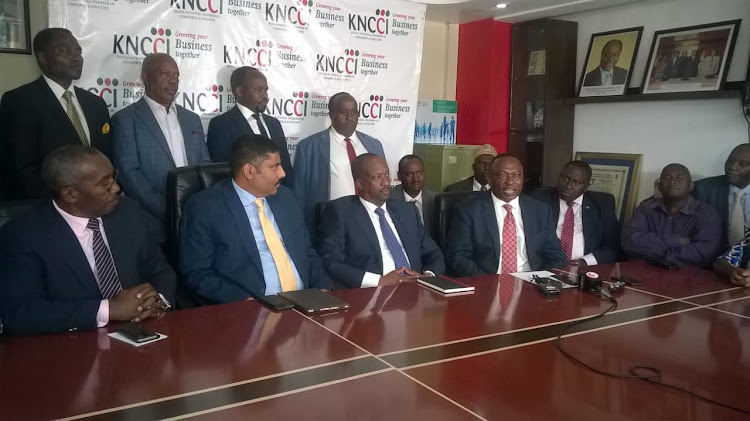 KNCCI chairman Kiprono Kittony (Third, Left, seated) and incoming president Richard Ngatia on Monday, May 13, 2019