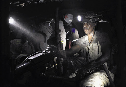 A miner at Marikana, where thousands of workers downed tools yesterday to push for the closure of NUM offices at the Rustenburg, North West mine. More than half of the workforce are now members of rival union Amcu