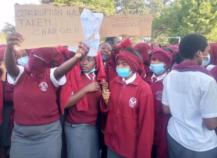 Students of Moi Girls carrying placards during the strike at the school on February 17.