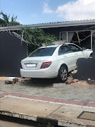 A woman was injured when a car ploughed through a wall and her lounge window in Sophiatown, Johannesburg.