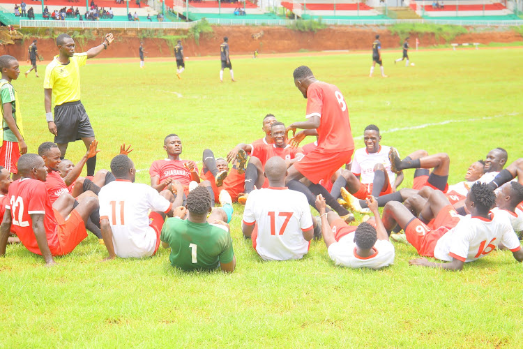Shabana's Peter Ogechi celebrates with team-mates after scoring a penalty against Mombasa Elites