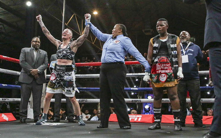 Hedda Wolmarans celebrates as she is declared the winner over Malawi's Ruth Chisale in Johannesburg on Thursday night.