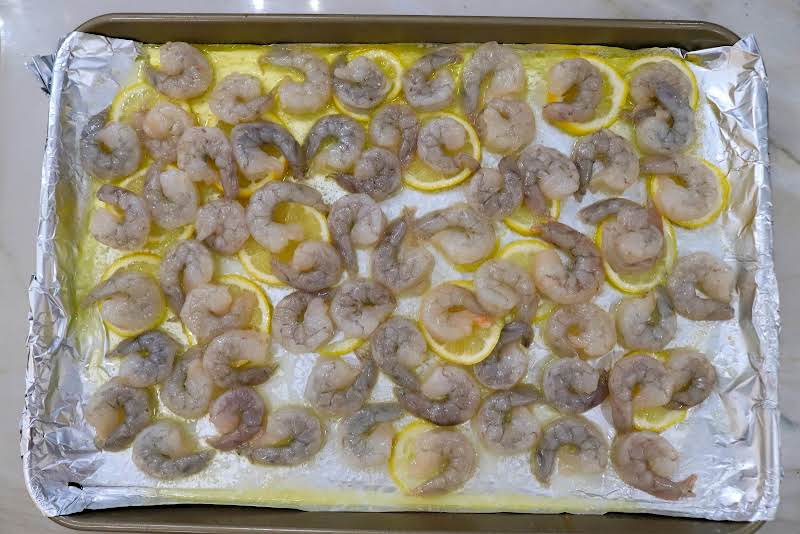 Shrimp Placed On Top Of Lemon Slices.