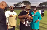 A screengrab of Shauwn Mkhize and her son Andile Mpisane handing out hard cash to players following the 2-1 league win against Maritzburg United at Chatsworth stadium. The writer says there is nothing wrong with rewarding players after a hard-fought win, but order and decency must be the bare minimum in standards to be observed. 