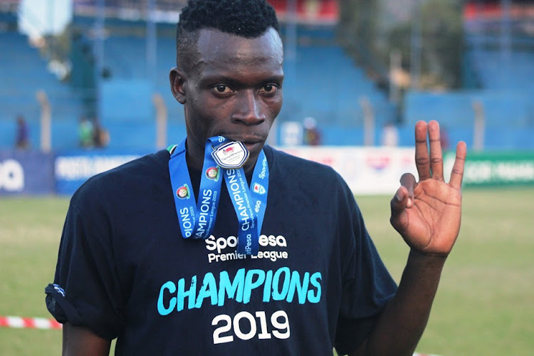 Gor Mahia right back celebrates with his league-winners medal