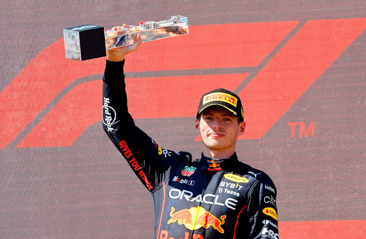 Red Bull's Max Verstappen celebrates on the podium with the trophy after winning the French Grand Prix at the Circuit Paul Ricard in Le Castellet, France, July 24 2022. Picture: ERIC GAILLARD/REUTERS