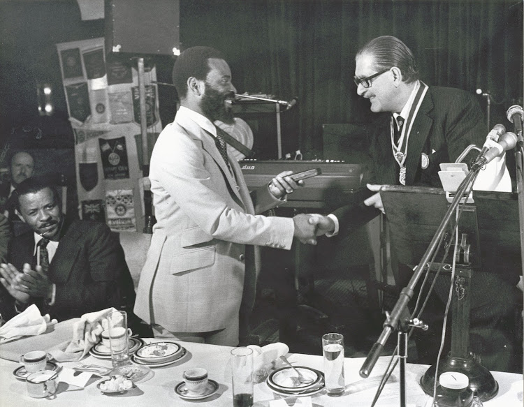 King Goodwill Zwelithini Zulu shakes hands with Willie Jordaan, president of the Johannesburg Rotary Club, on May 15 1979.