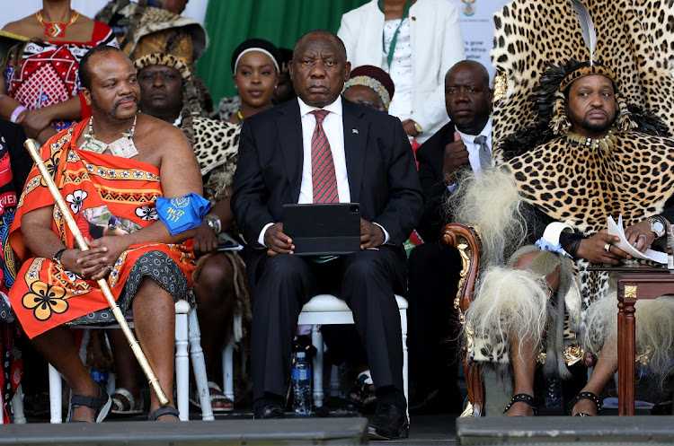 President Cyril Ramaphosa flanked by King Mswati III and King Misuzulu kaZwelithini at the ceremonial handover of the certificate of recognition at Moses Mabhida Stadium in Durban.