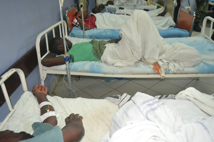 Some of the survivors of the Comoros boat tragedy being treated by Kenya Navy personnel at the Malindi Sub county hospital