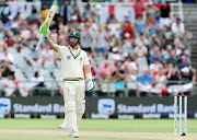 Pieter Malan raises his bat to celebrate his half century on debut at his Newlands home ground. 