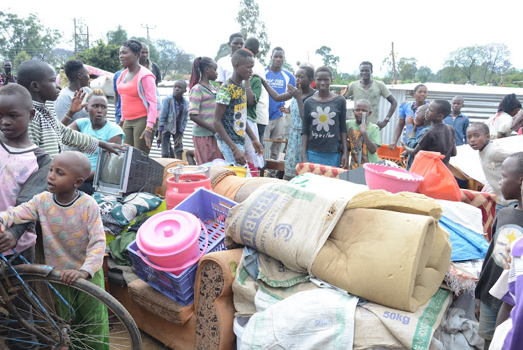 Residents of KCC village in Naivasha shift to safer places after their houses were flooded by River Malewa