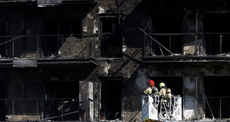 It was not until after midday on Friday that firefighters were able to enter the charred ruin of the flats