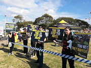 A small group of animal rights activists gathered outside Durban's Greyville Racecourse on Saturday morning to protest against the country's biggest race horsing event. 