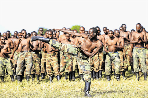 An M23 recruit demonstrates his martial arts skills during a training session at the Rumangabo military camp in eastern Democratic Republic of Congo, yesterday. About 1000 South African soldiers will face close to 5000 battle-scarred M23 fighters