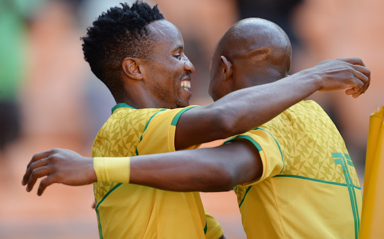 Themba Zwane of South Africa celebrates his goal with Zakhele Lepasa during the international friendly match between South Africa and Sierra Leone at FNB Stadium on September 24, 2022 in Johannesburg, South Africa.