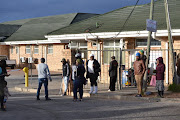 Patients mill about outside Motherwell Community Health Centre, where nurses have been staging a sit-in since Monday. 