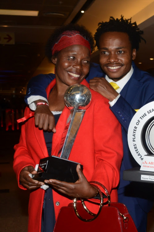 Footballer of the Season Percy Tau pose for a picture with his mother Elizabeth Tau during the Premier Soccer League 2017/2018 Awards evening at Sandton Convention Centre on May 29, 2018 in Johannesburg, South Africa.