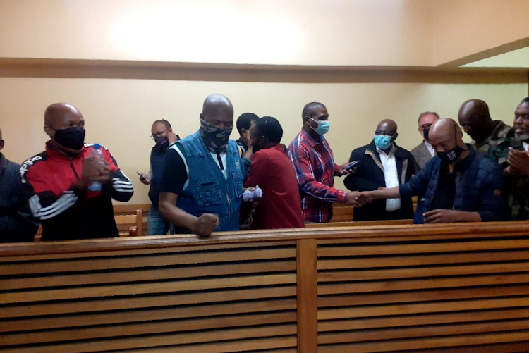 Military veterans celebrate after being granted bail on Friday.