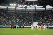 FC Zurich's and Arsenal's players line up during a minute of silence following the announcement of the death of Britain's Queen Elizabeth II ahead of the Uefa Europa League Group A first leg football match at Kybun Park stadium in St Gallen on September 8 2022.