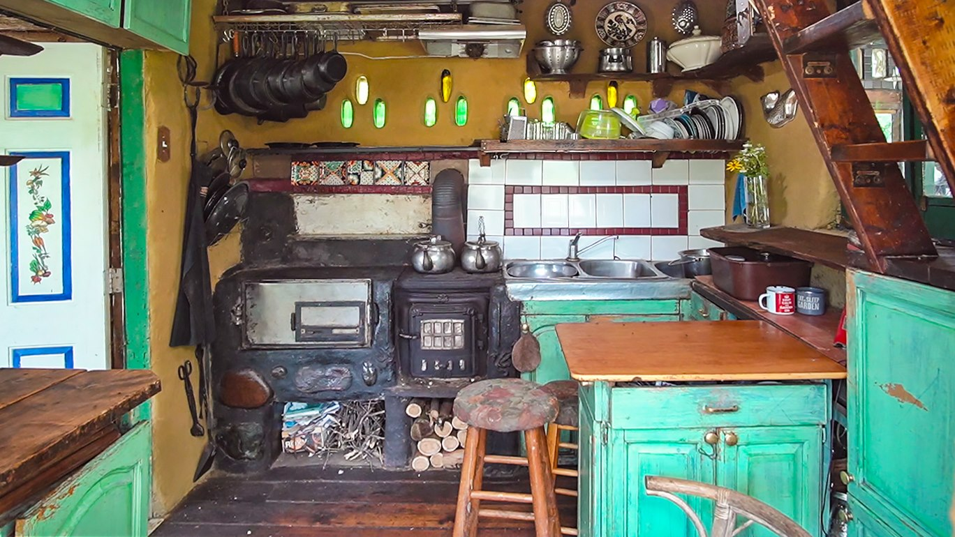 Misty and Bryce Murph’Ariens kitchen in their clay home off-grid