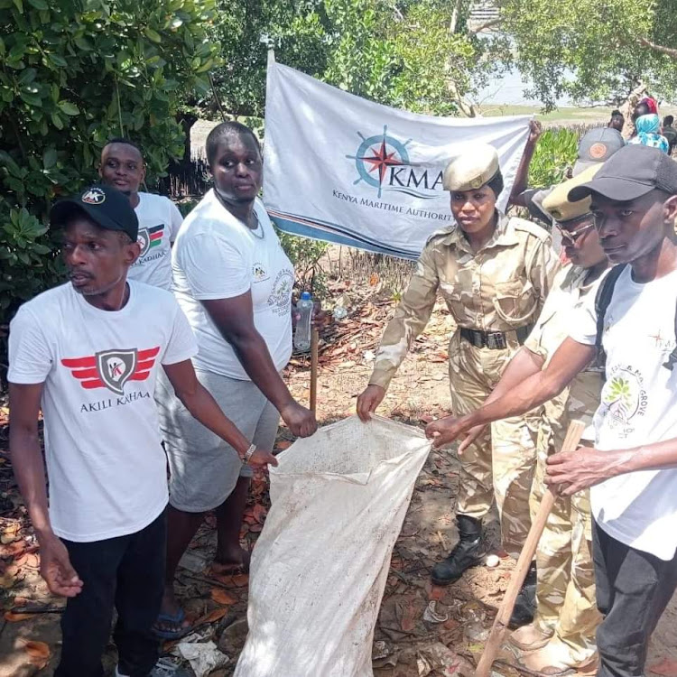 Akili Kadhaa CBO members in a beach clean-up exercise on Thursday.