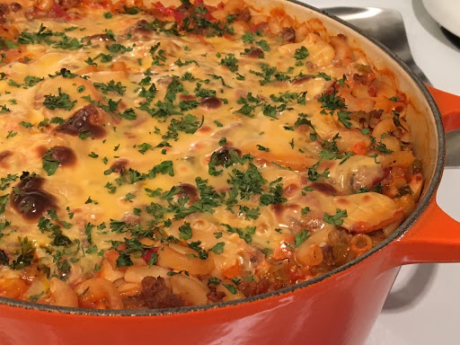 Macaroni casserole in a large Dutch oven on the stove.