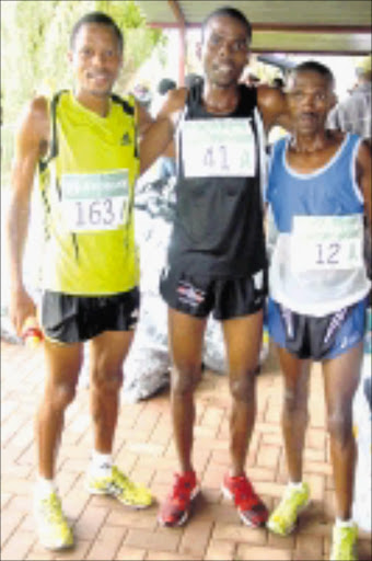 TOP TRIO: Last year's winner, Wirimai Juwawo, is flanked by second-placed Hendrick Ramaala, left, and third-placed Mabuthile Lebopo. Cicra 2008. Pic. Unknown