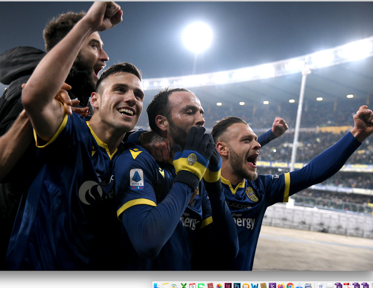 Verona players celebrate after the match