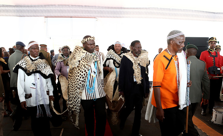 Chiefs carry the lion and leopard skins of the late king during the special official funeral at Nqadu Royal Palace.