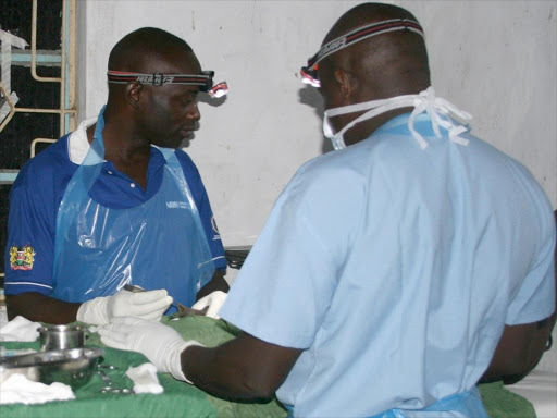 Medics circumcise a man during a campaign for voluntary medical male circumcision.