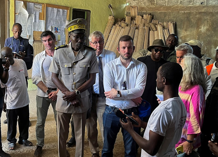 Virginijus Sinkevicius, European commissioner for environment, oceans & fisheries, stands with Francesca Di Mauro, EU ambassador to Ivory Coast, during a visit at a cocoa producing co-operative in Agboville, Ivory Coast, April 7 2024. Picture: REUTERS/Ange Aboa